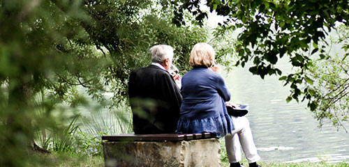 Older couple sitting on bench